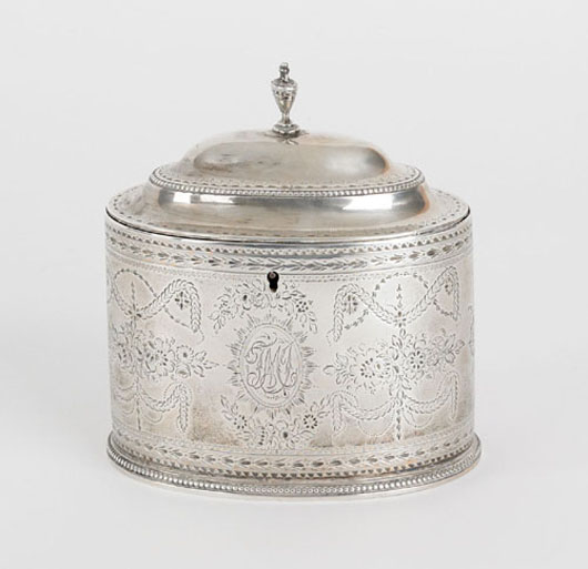 Georgian silver tea caddy 1783-4, bearing the touch of Hester Bateman with elaborate overall engraved floral and swag decoration, 5 1/4 inches high, 5 inches wide, $5,451. Image courtesy of Pook & Pook Inc.